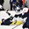 GRAND FORKS, NORTH DAKOTA - APRIL 16: Slovakia's Filip Krivosik #22 falls to the ice while Finland's Emil Oksanen #23 looks on during preliminary round action at the 2016 IIHF Ice Hockey U18 World Championship. (Photo by Matt Zambonin/HHOF-IIHF Images)

